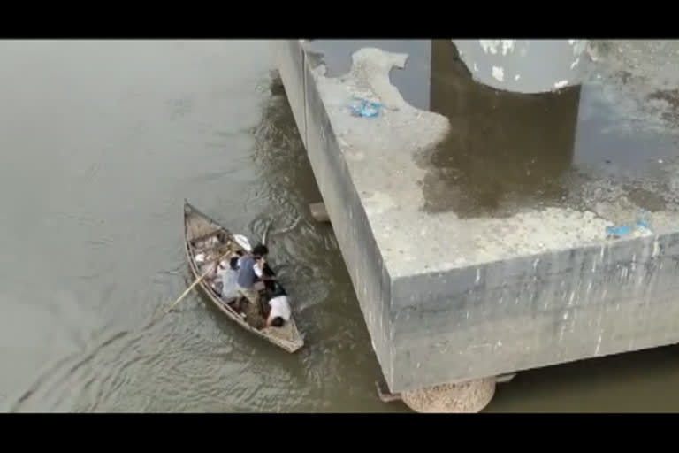 person jumps into the Narmada River from the Goldenbridge in Bharuch