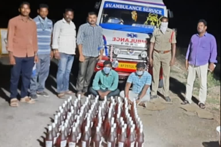 illegal transport of liquor seazed and two members were arrested in veerulapadu at vijayawada