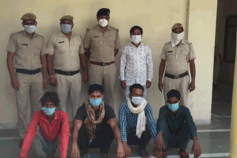 Four accused arrested for robbing liquor shop in bhiwani