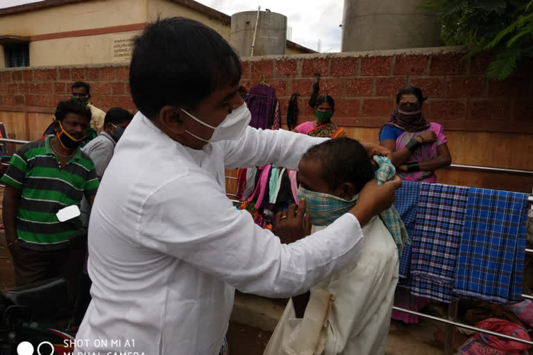 The MLA tied towel as mask to a person in Muddebihala