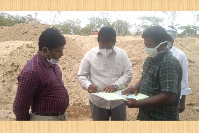 officers examining the sand dumping yard