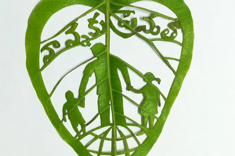 teacher make an art on leaf on the special eve of international father's day