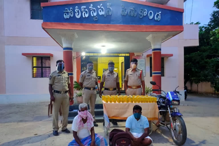 Illegal karnataka wine seize and two men arrest in kondapalli ananthapuram district