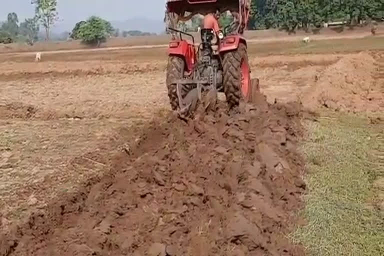 Laborers work because of tractor