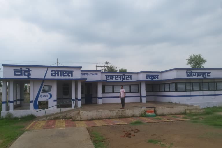 Workers paint the school