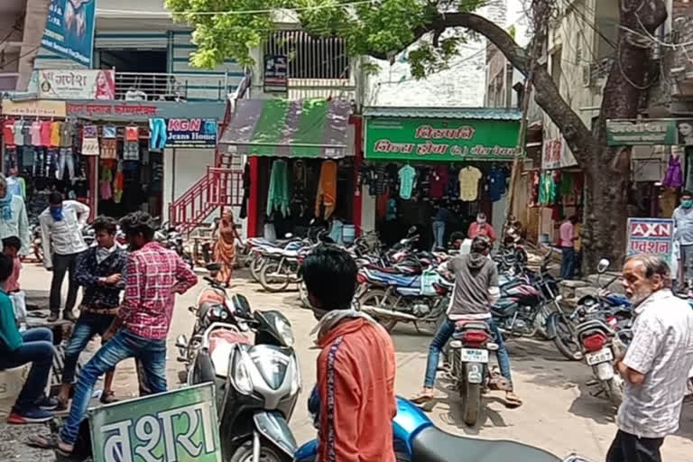 People walking around in the market without masks