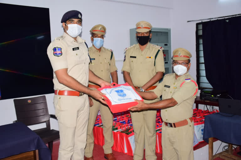 rajanna siricilla sp rahul hegde distributed helth kits to constables