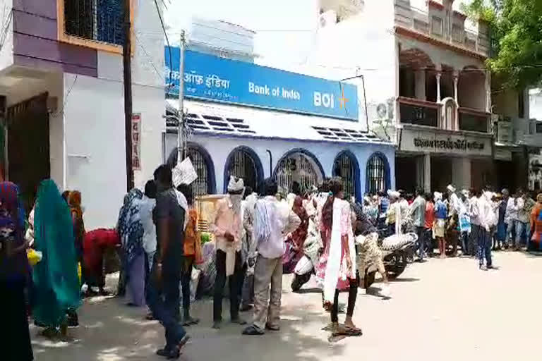 Crowd of villagers outside the bank