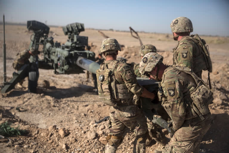 US Soldiers with Task Force Iron maneuver an M-777 howitzer, so it can be towed into position at Bost Airfield, Afghanistan. (File pic)