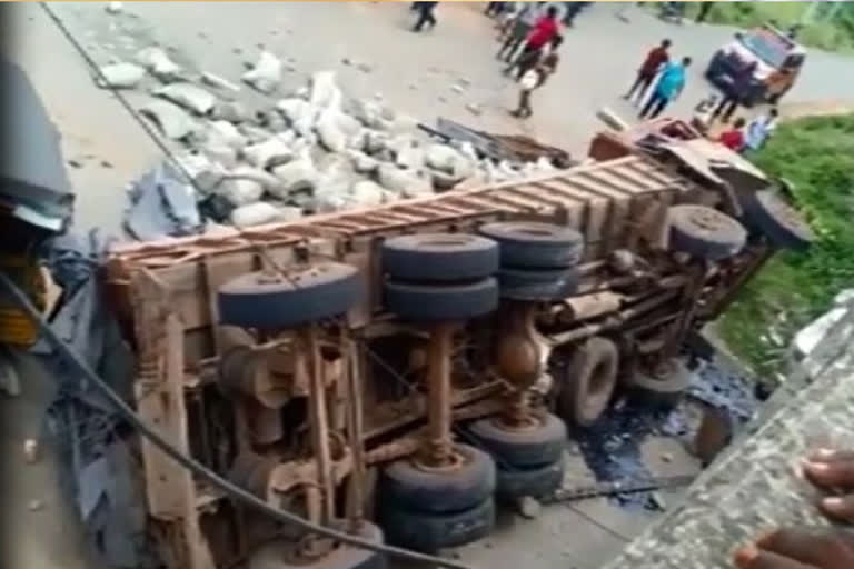 lorry over rolled at kothapall river and cleaner injured