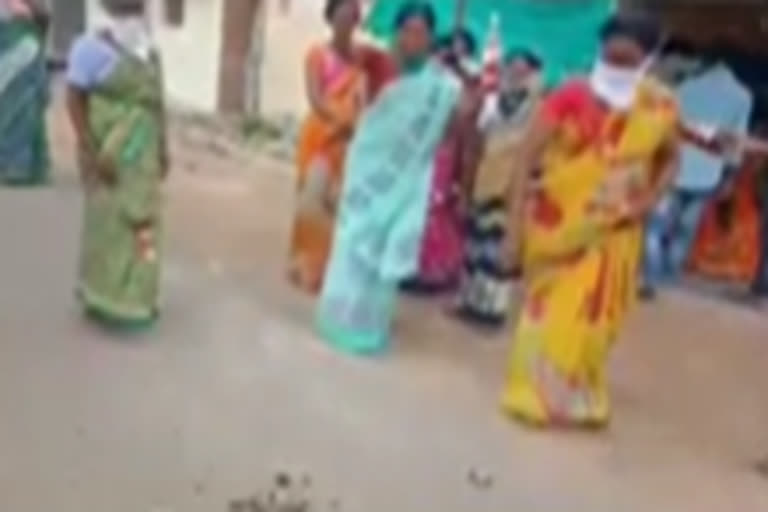 women attack on belt shops at adilabad