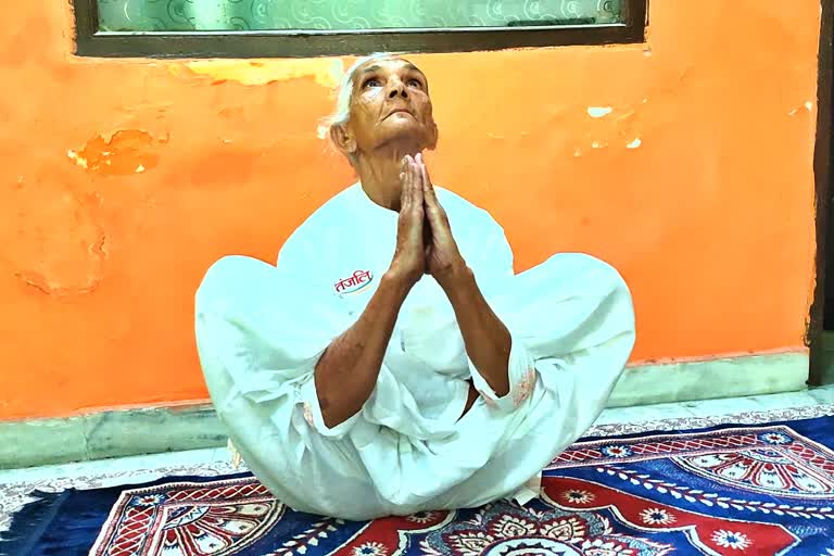 75-year-old woman running yoga class