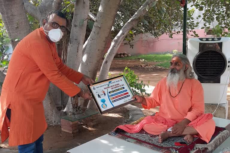 stickers placed in religious places to make people aware of corona in bhiwani