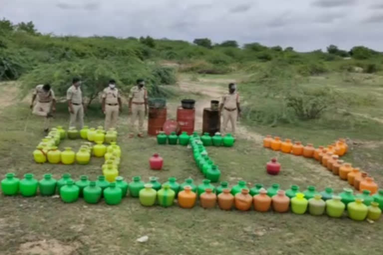 police raids on basinepalli village and caught 2500 litres of cheap liquor