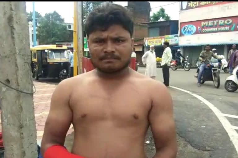 A young man spitting Gutka in the street