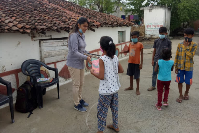 seema distributed books to children