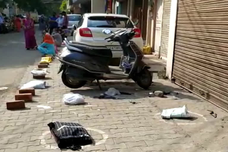 line for ration before shop opened in west delhi