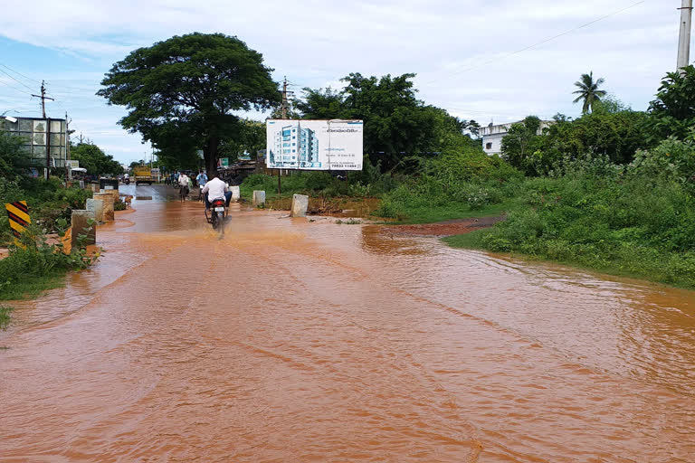 floating at vishaka dst elemanchali national highway due to rain water