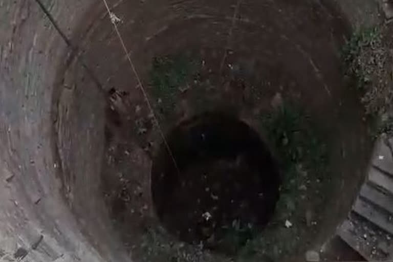 Drunk man falls into a well