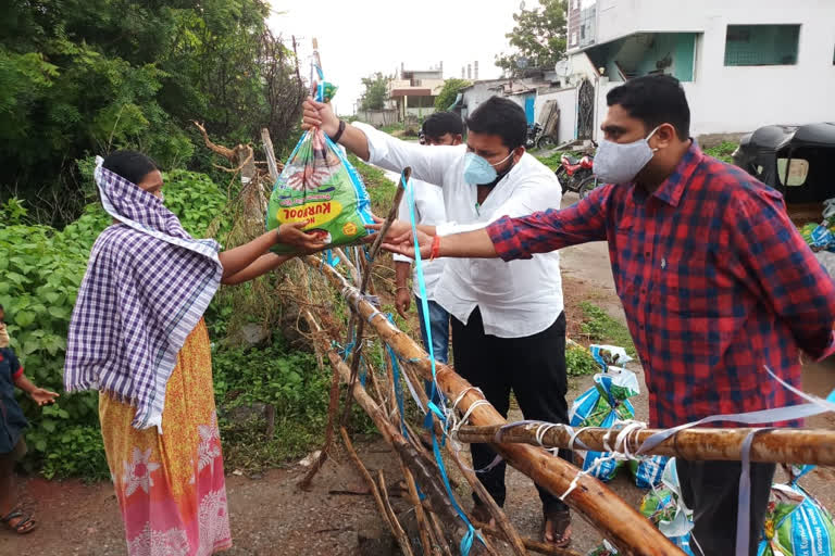 groceries distribution in containment area at kagaz nagar in kumurambheem