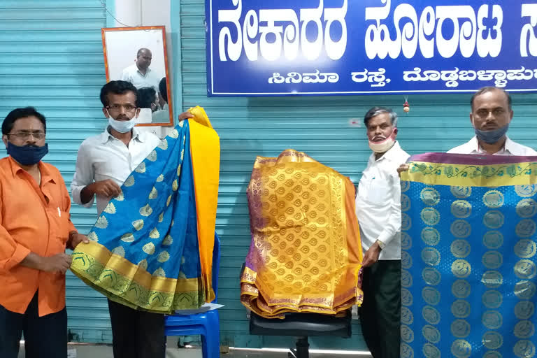 Distribution of free saris to government employees