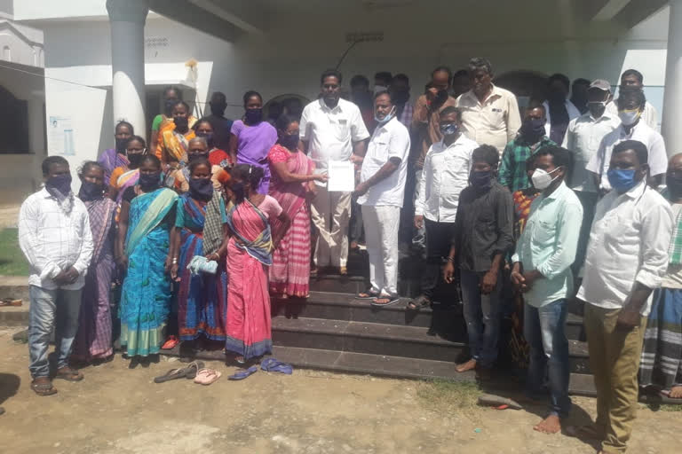 tribals at vishakapatnam request to mla to give documents to lands