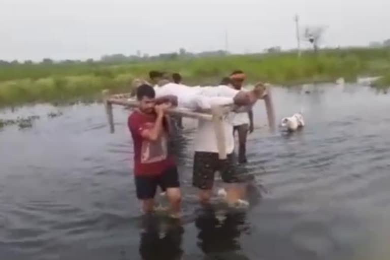 UP: Man carries grandfather on cot due to lack of road connectivity