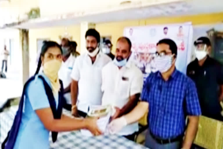 text book distribution to students at nalgonda