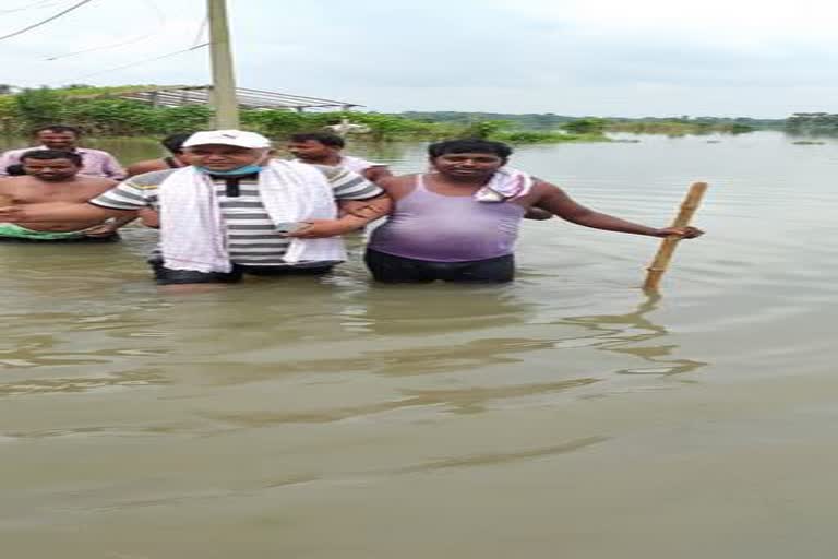 people troubled due to raining water on road