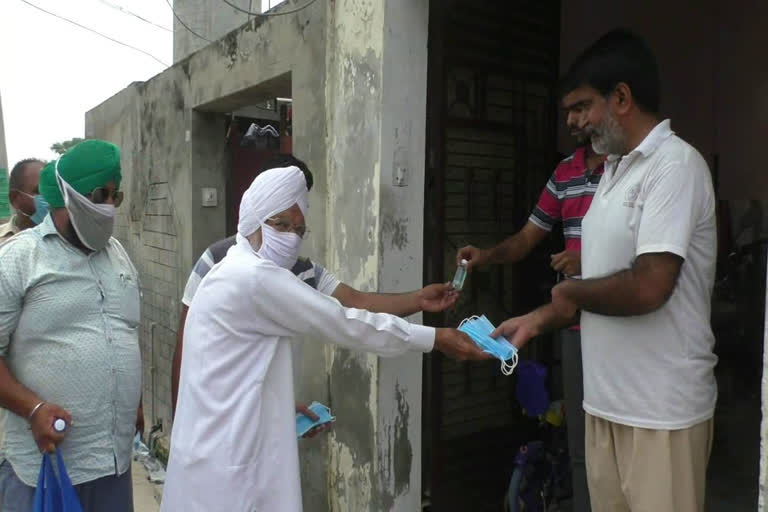 Social workers go from house to house distributing masks, sanitizers