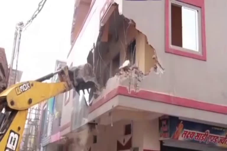 Bulldozer breaks the house