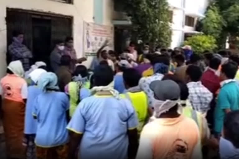 labours protest against in metpally municipal office