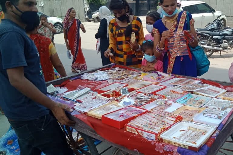 people shopping rakhi on the day of rakshabandhan in nangloi market