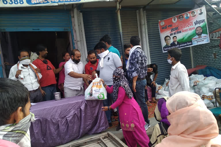 congress workers distribute ration to needy people at badarpur in delhi