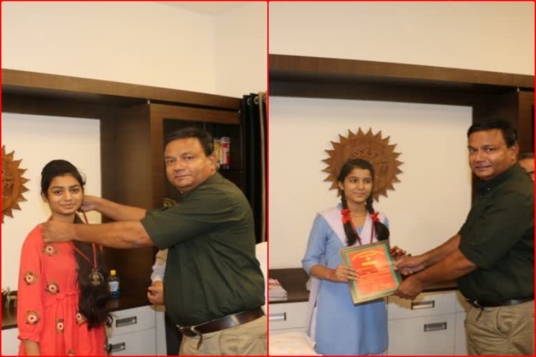 The commissioner honored the girl students