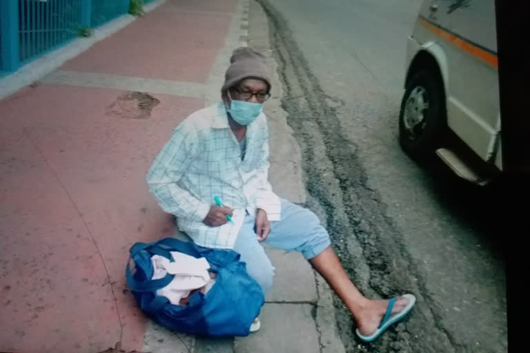 A patient sitting on the street