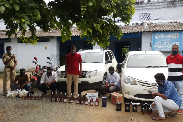 wine seized to illegal moving from telangana at kurnool, krishna district