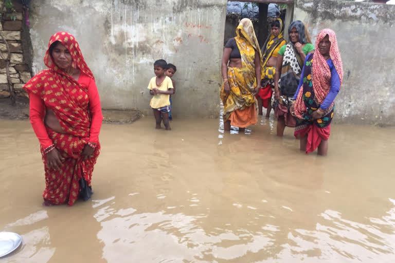 Rain water enters houses due to not having a bridge on the road