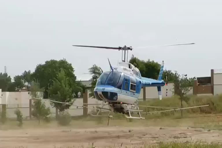 Spraying for locust control,  spray through helicopter