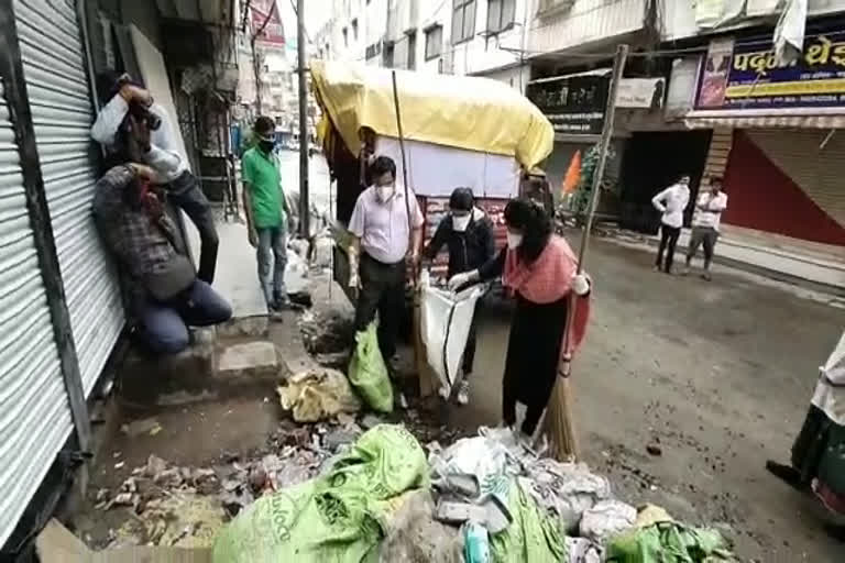 Officers and public representatives clean city