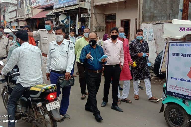 Importance of masks explained through rally in ujjain