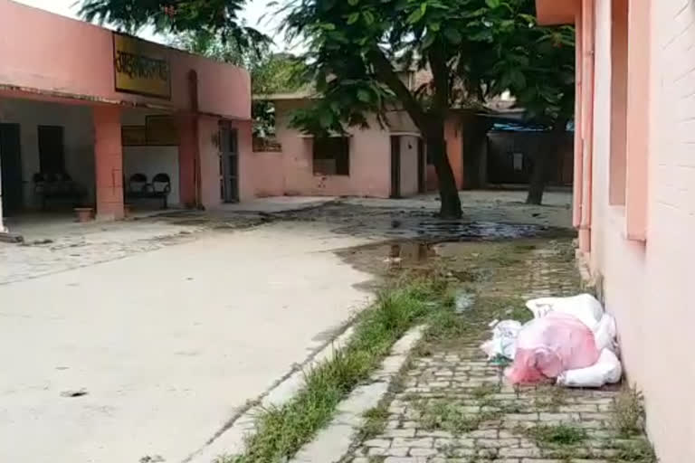 health workers throw ppe kit outside corona testing center