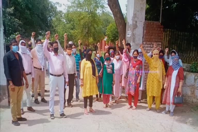 Employees of Mewat Model School protested over non-payment of salary