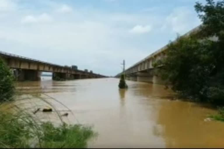 heavy flowing godavari river at gowtahmi and vasishta bridges