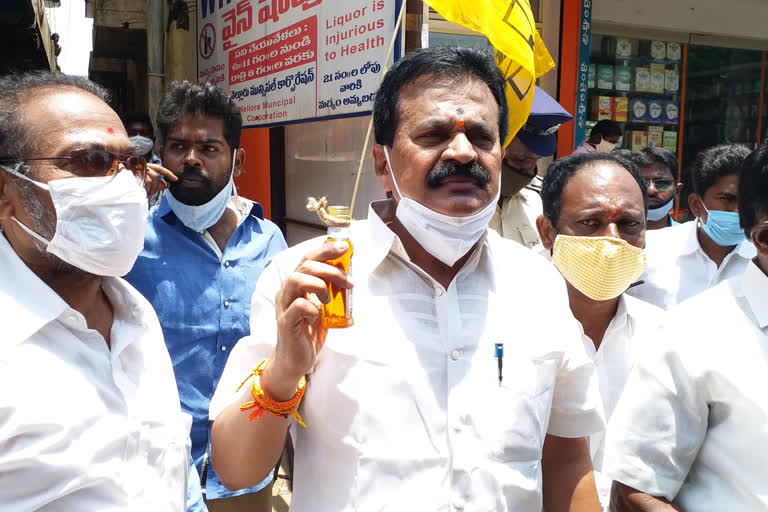 tdp protest at liquor shops in nellore town and demands to close wine shops in state