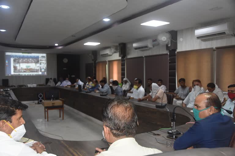 JP Dalal talks with farmers in bhiwani