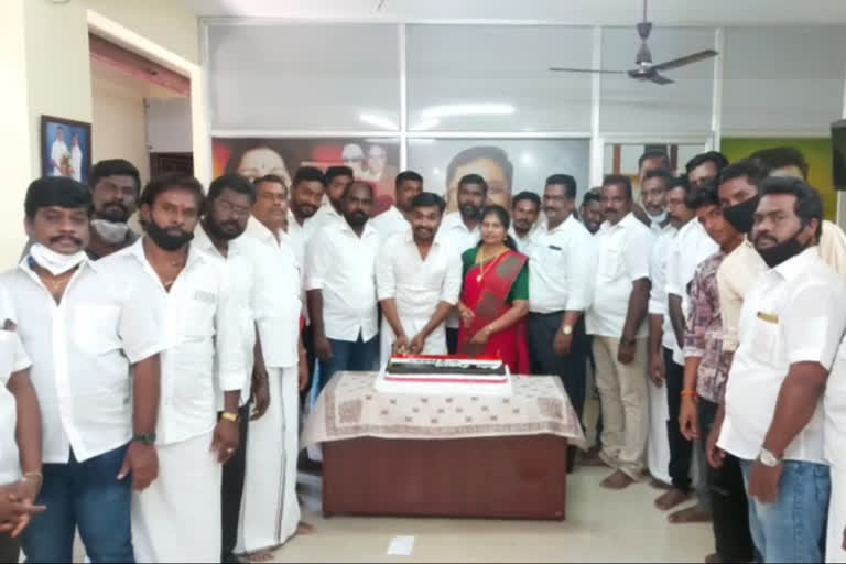 Volunteers cut a cake to celebrate Sasikala's birthday