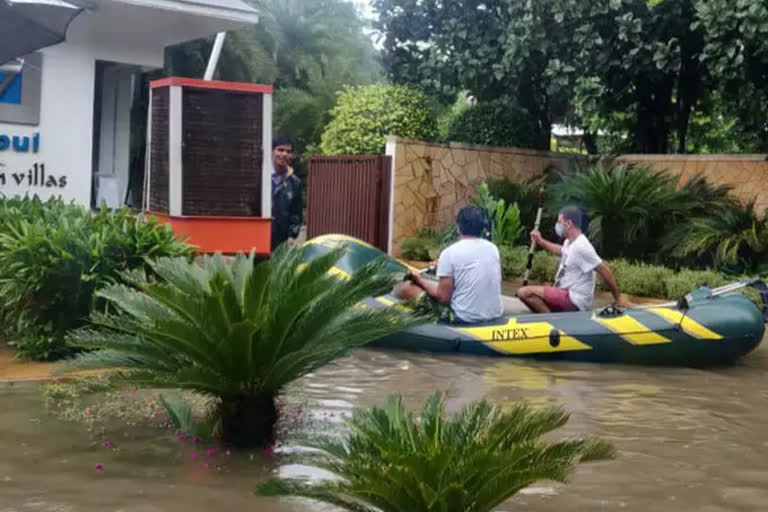 gurugram people doing boating on water logged road in the city