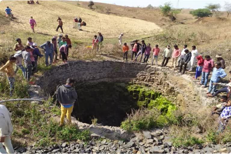 A young man in a well