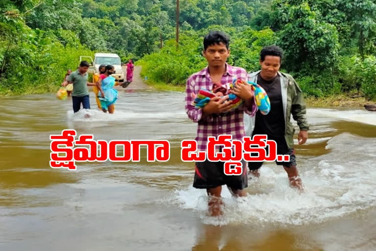 The locals crossed the river with the baby in rampachodavaram